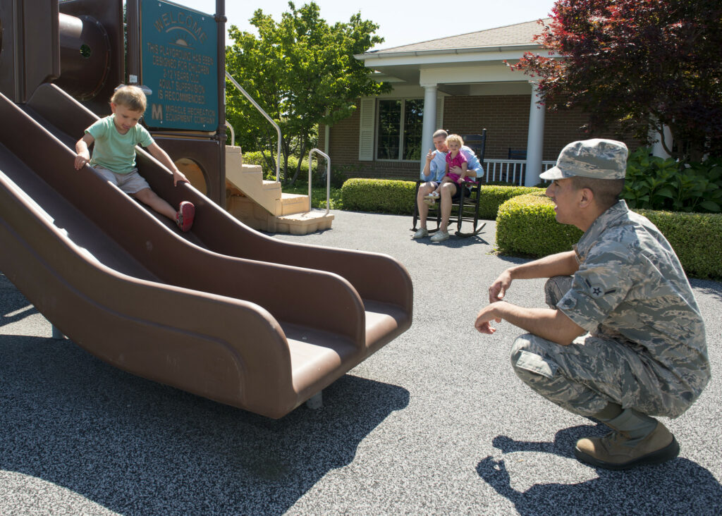 soldier playing with his son